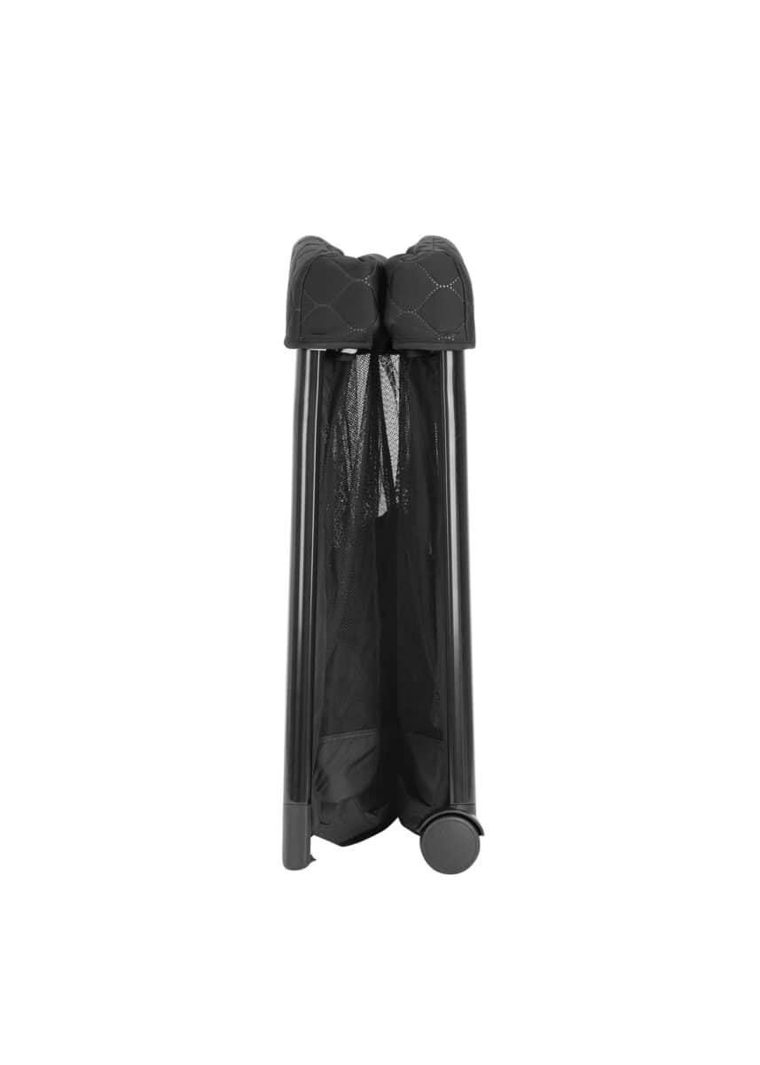 Folded Graco FoldLite LX travel cot in a compact, upright position with black fabric and mesh design.