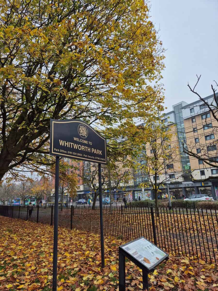 Whitworth Park in Manchester entrance with sign.
